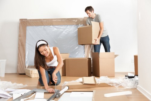 Moving boxes and furniture prepared for a Chelsea flat removal