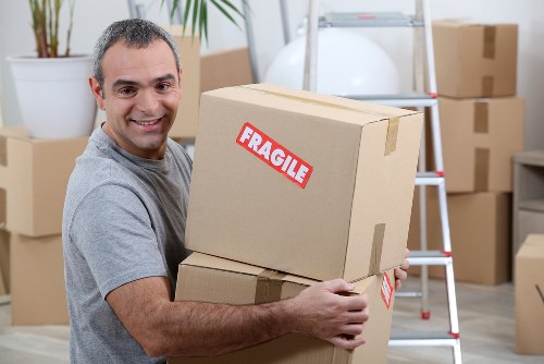 Removal van loading furniture outside a Chelsea townhouse