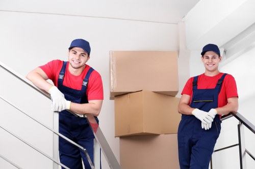 Furniture pick-up service removing a sofa in Chelsea