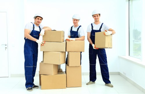 Professional movers loading furniture into a removal van in Chelsea