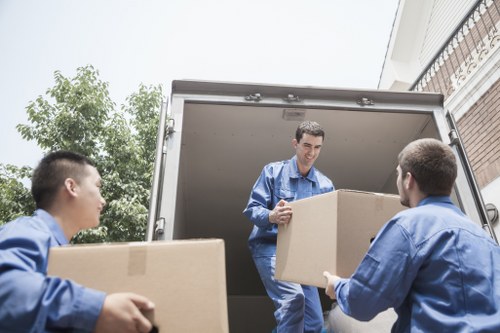Removal team planning a move in Chelsea residential street
