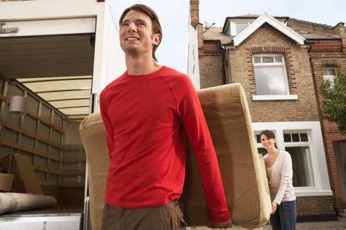 Removal staff carefully handling furniture during a Chelsea move
