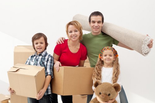 Unpacking boxes in a Chelsea apartment after a move