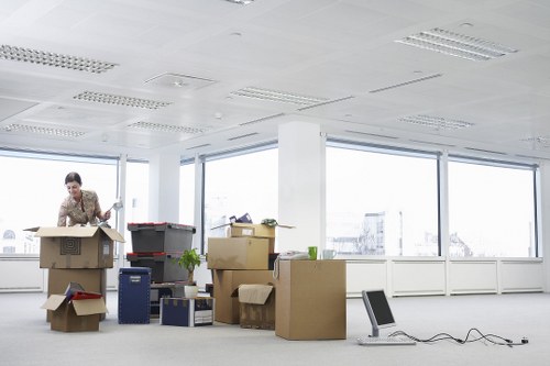 Office furniture and boxes prepared for a Chelsea business move